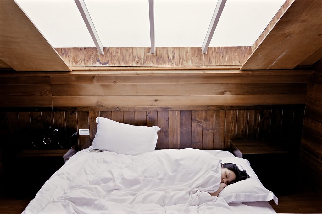 A woman sleeping in a bed