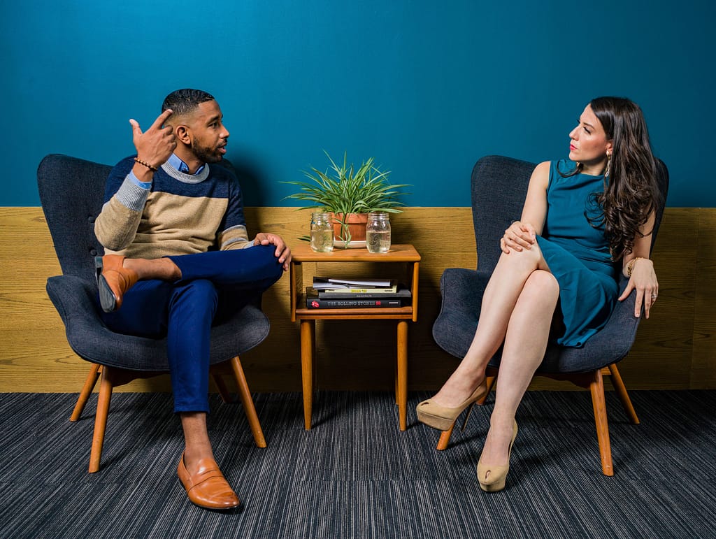 A man talking to a woman in a counseling session