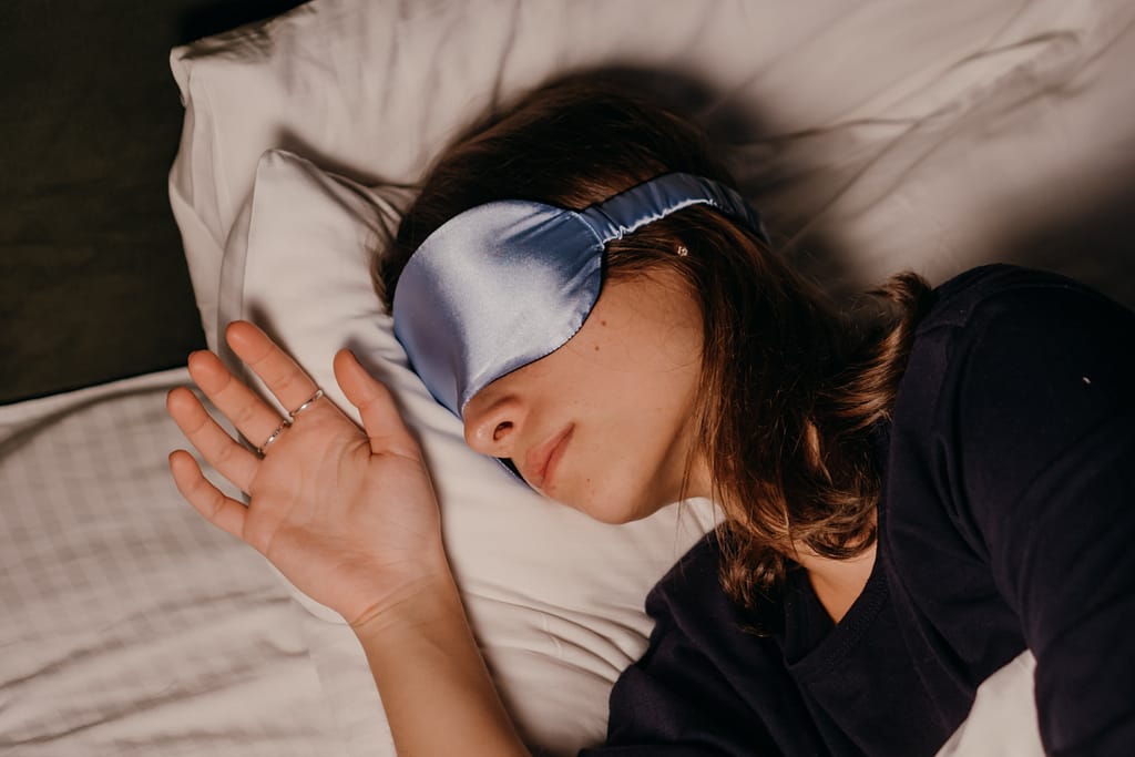 How to wake up feeling refreshed with a woman sleeping with silk eye mask covering her eyes