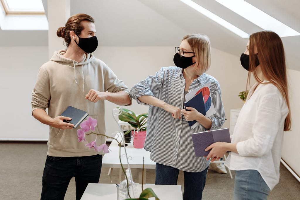 How to say no without feeling guilty by showing three people with masks compromising
